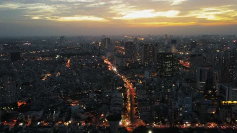 Drone-hyperlapse-over-the-night-city-skyline,-Ho-Chi-Minh-City,-Vietnam