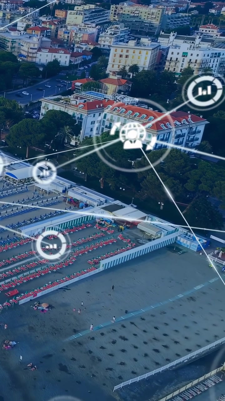 Video verticale: Nodo centrale in emersione, sovrapposizione AR che collega un resort sulla spiaggia, mappando la crescita della rete.