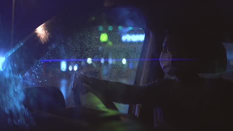 the man in medical mask sitting in the car
