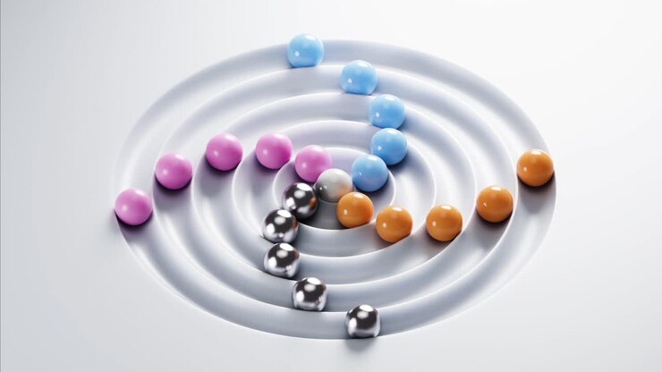 Colorful Spheres Rolling in Concentric Grooves on White Surface