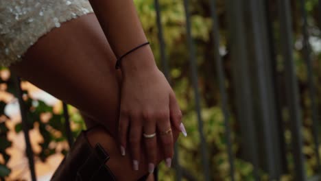 beautiful legs of an attractive woman with boots in a park. slow motion, blonde, no face.
