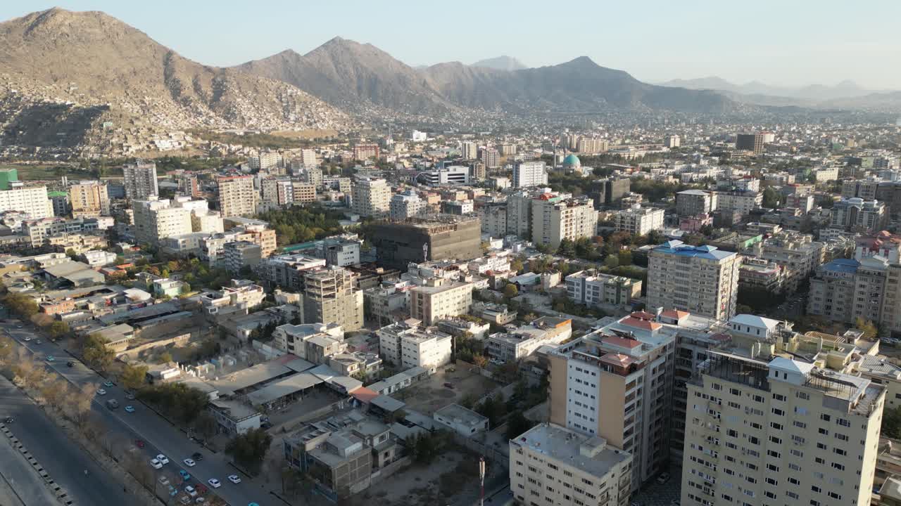 Kabul Aerial Drone View of Afghanistan, Street Traffic and Residential Buildings with mountains in background