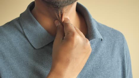 man checking his throat