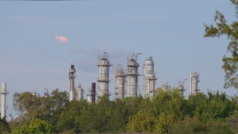 establishing shot of chemical refinery plant in pasadena, texas community