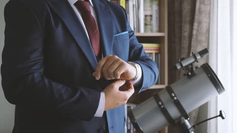 groom's preparing his watch in his room