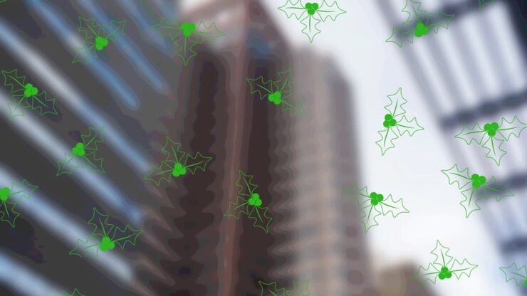 Múltiples iconos de muérdago navideño verde en un patrón continuo con edificios altos de fondo.