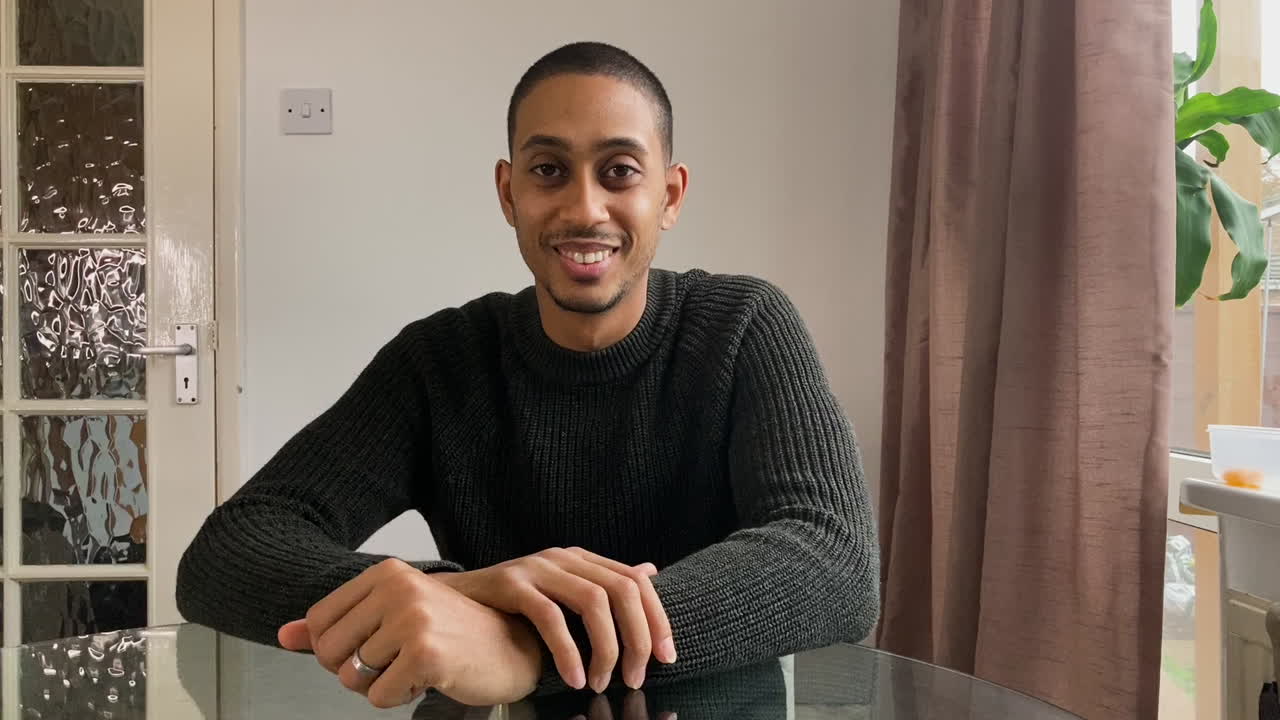 Young Man On Video Call Listening to a Friends Story Directly into Camera