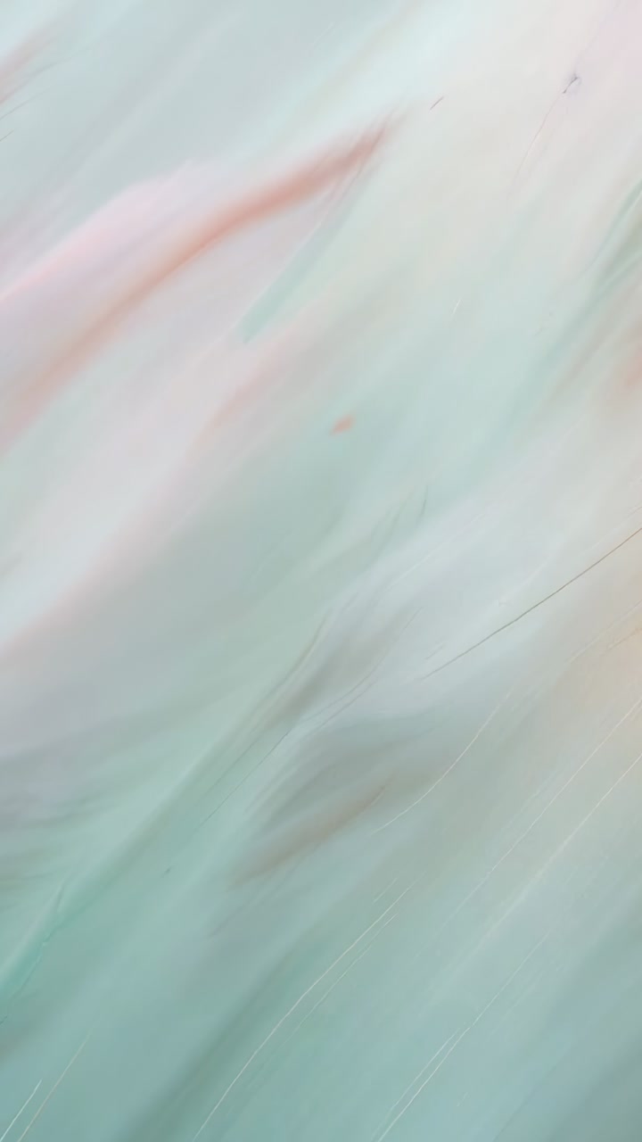 Vertical video: Shifting camera showing marbled surface in closeup to document fine scratches, dust