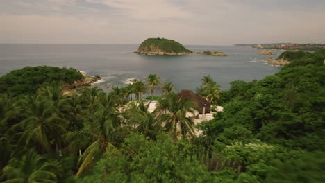 Aerial-over-picturesque-seascape-along-the-mesmerizing-coastline-in-Huatulco,-Mexico