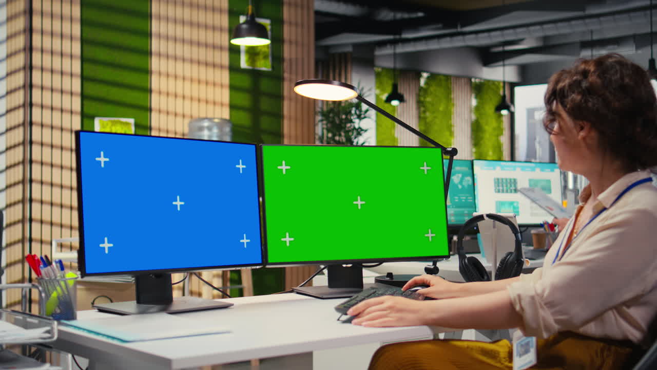 Focused office administrator using data for forecast with a green screen