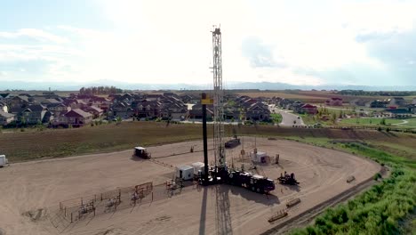 4k drone shot reveals a drilling rig right in the middle of fancy neighborhood