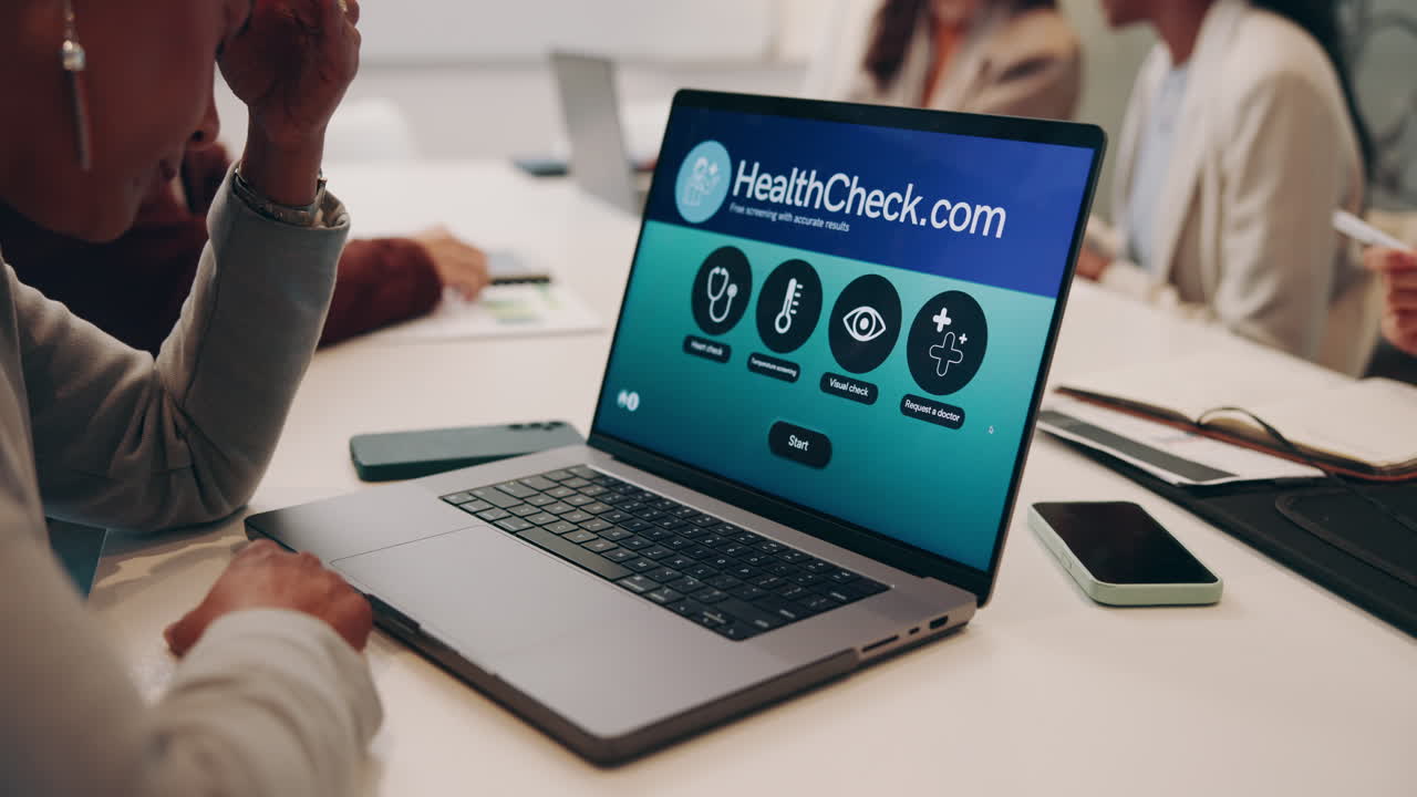 Woman using health check website on laptop