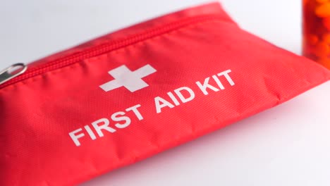 first aid kit and pills