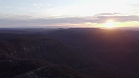 Aerial-shot-of-rolling-hills-during-sunrise-on-a-beautiful-day