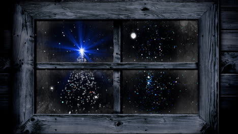 animatie van kerstboom en sneeuw die door het raam valt.