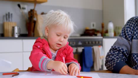 father helping his daughter in drawing at home 4k