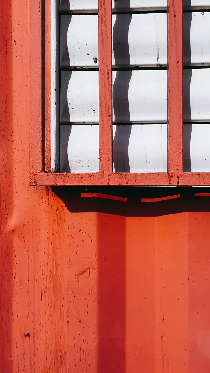 Red Metal Wall with Window and Shadow