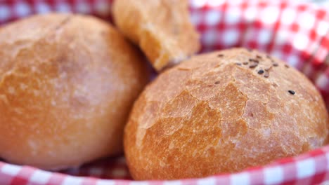 close up of freshly baked bread rolls in a basket