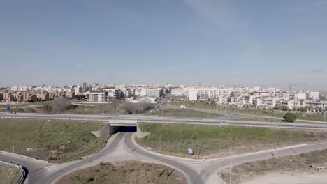 Altamura,-Italy-skyline-with-highway-and-traffic-with-drone-video-moving-up