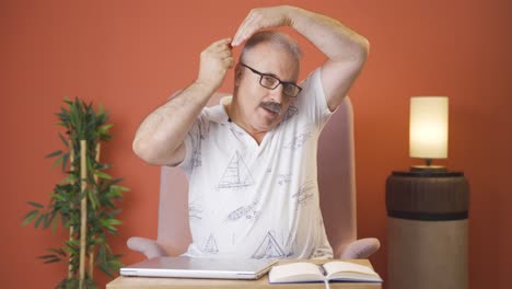 old man combing his hair.