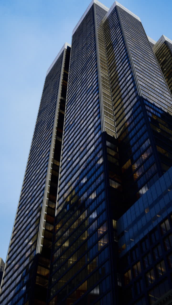 Skyscraper towering above city buildings during twilight