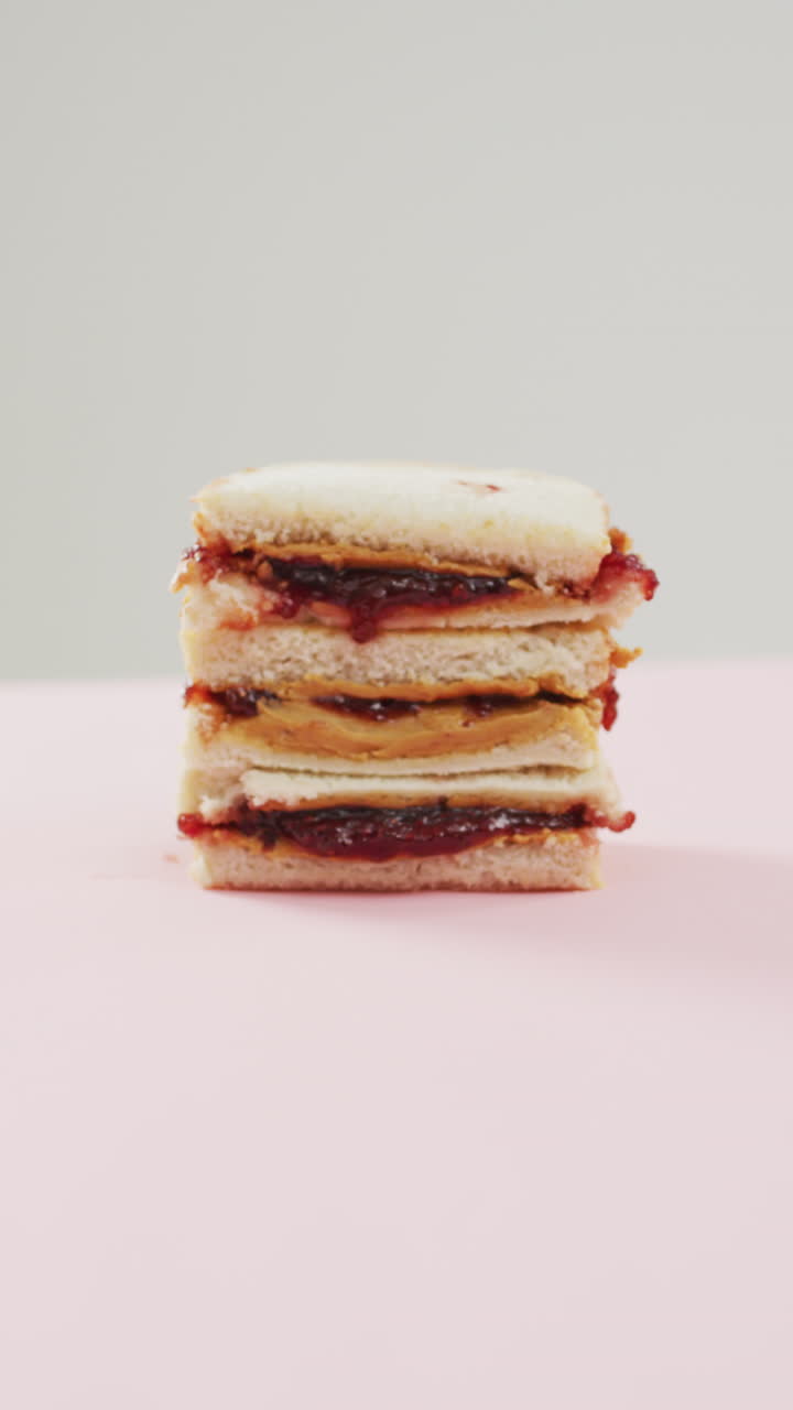 Vertical video of sandwich with jam and peanut butter