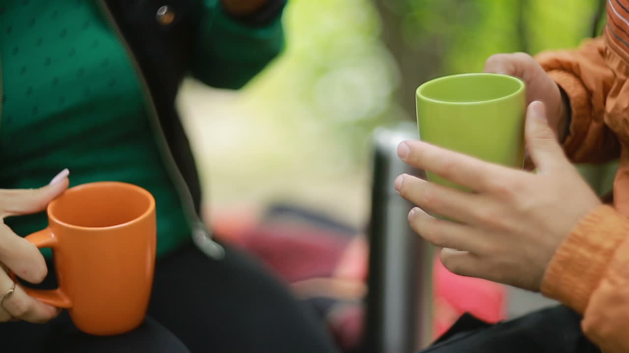 Loving Couple Drinking Tea. Romantic couple sitting in nature and drinking tea