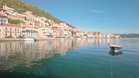 scenic greek town gytheio reflected in calm harbour waterfront