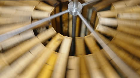 Centrifuge device is spinning to make honey drip away from cells. Special apparatus work for getting fresh honey.