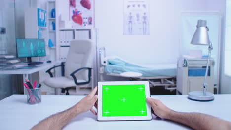 Pov-shot-of-assistant-holding-tablet-pc