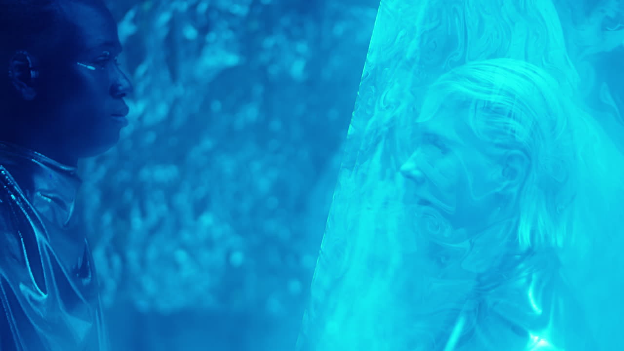 Man Looking through Laser Light at Alien Woman