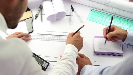 close up of mans hands drawing modern office