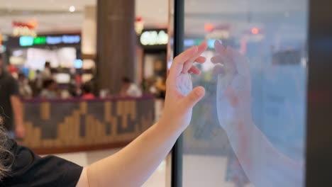 woman using interactive touchscreen map