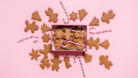 Gingerbread-cookies-making-a-Christmas-gift-box,-stop-motion-animation.-Cookies-gift-box