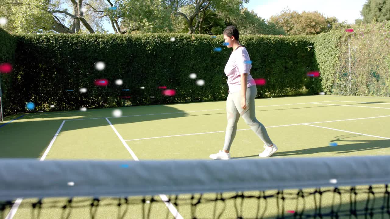 Female tennis player tossing serving and walking right while confetti supporting sports training