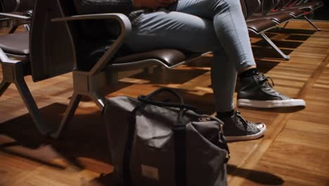 commuters using mobile phone in waiting area 4k