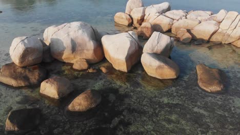 Famous-big-granite-boulders-at-Tanjung-Tinggi-Beach-Belitung,-aerial