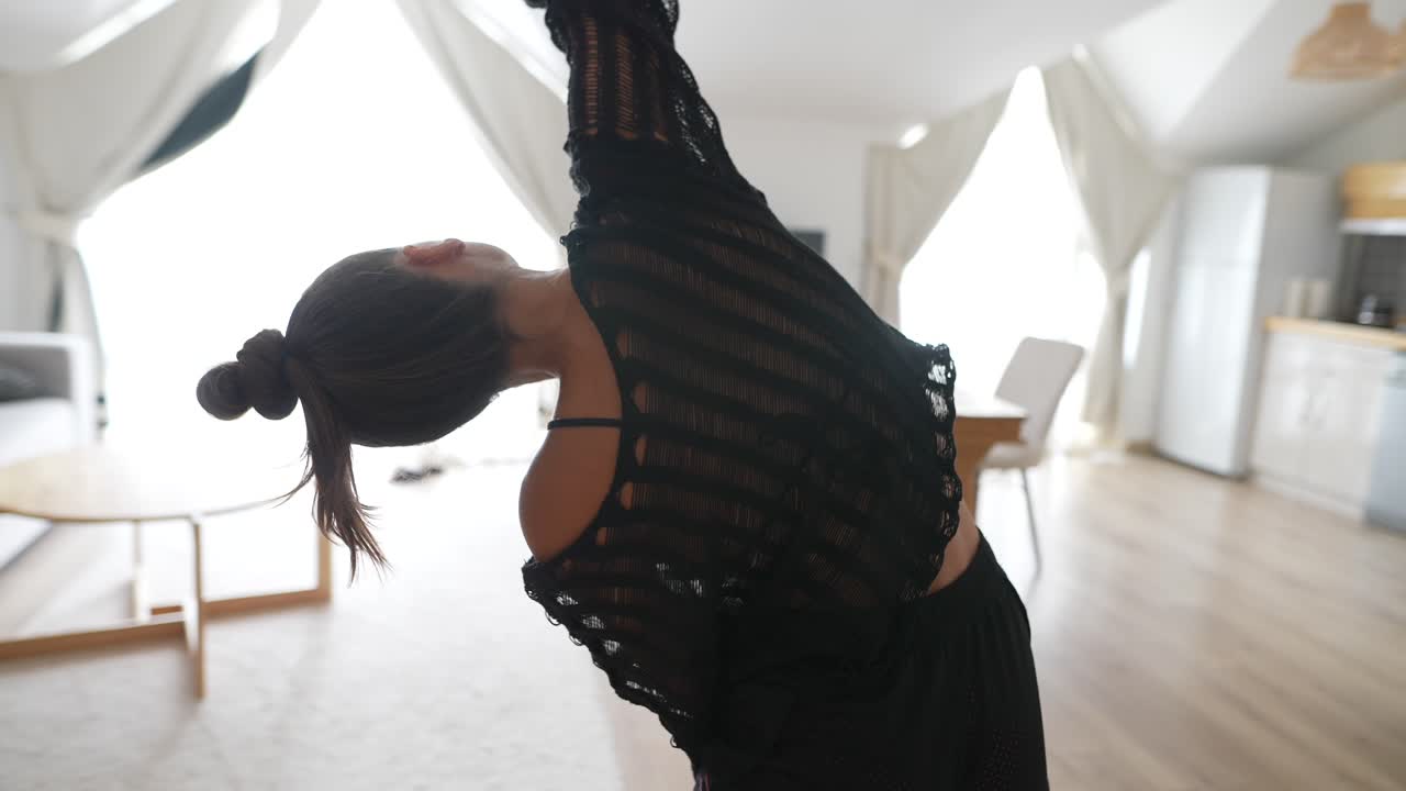 Woman Doing Yoga Stretches at Home