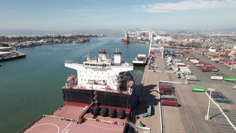 Intermodal-container-ship-docked-at-industrial-shipping-yard