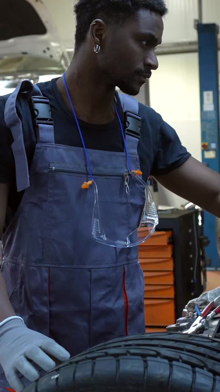 Car Mechanic Working on Engine
