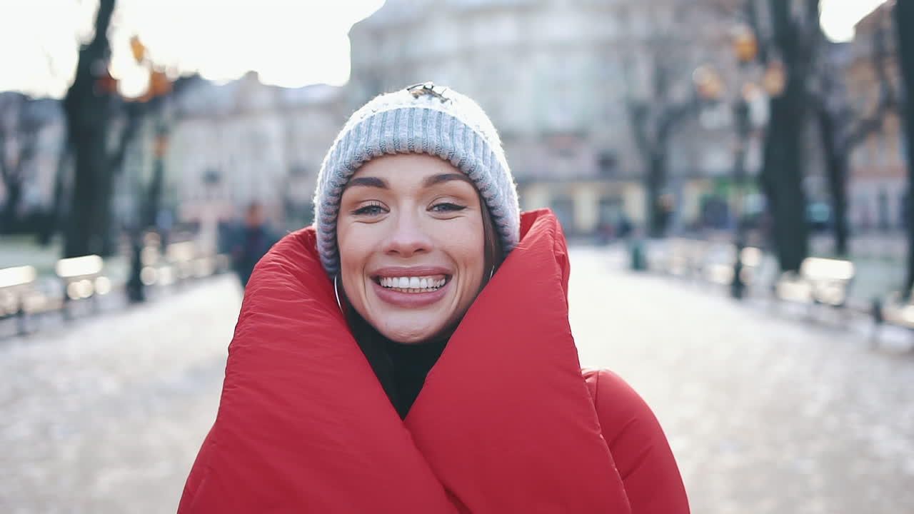 Portrait of a Smiling Woman in Winter Clothing Outdoors