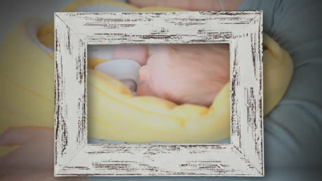 animation of frame over caucasian mother holding little baby