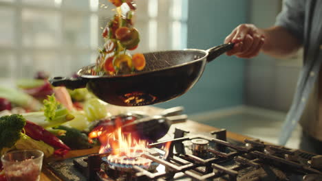cooking stir-fry in a wok