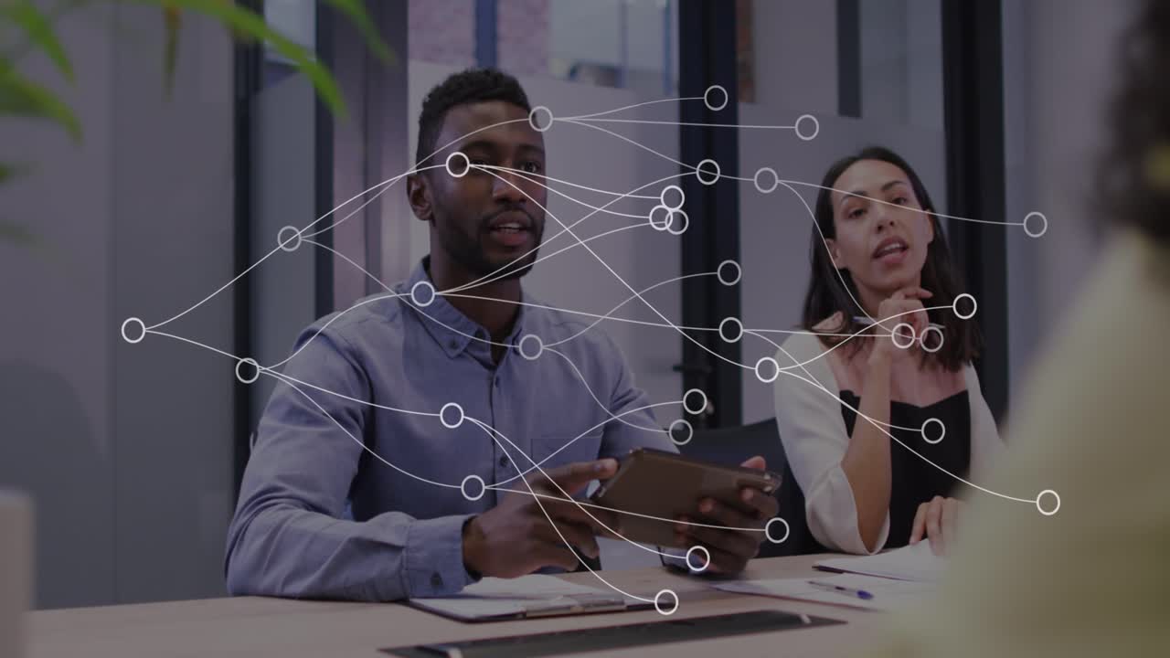 Animation of network of connections over smiling diverse business colleagues at meeting in office