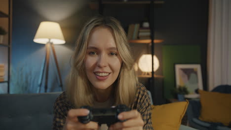 woman playing video games at home