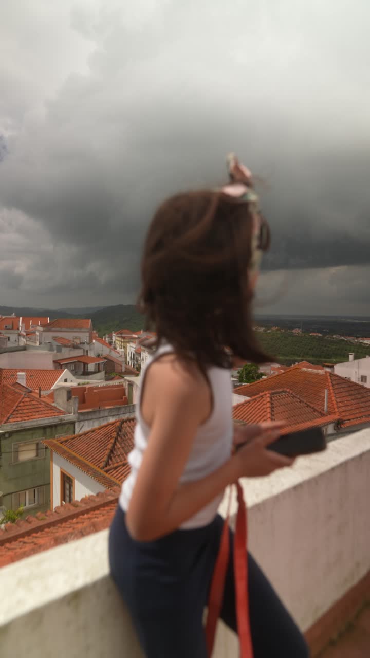 Child on Rooftop during Stormy Weather