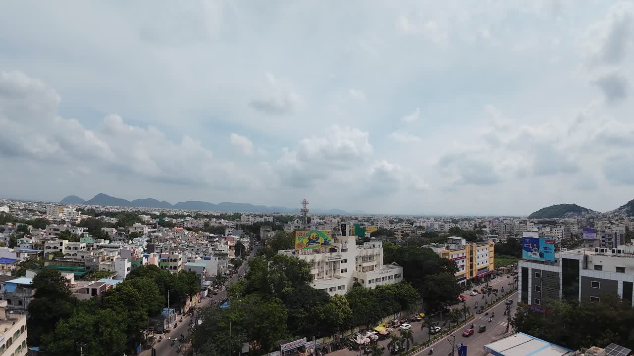 Drone video of the highway stretching through Amaravathi’s green fields under a clear blue sky.