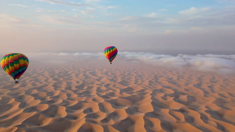 Hot Air Balloons Flying Over Vast Desert Dunes