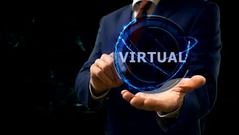 el hombre de negocios muestra el concepto de holograma vitrual en su mano.