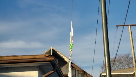 Air-Drying-Clothes-Hang-On-Clothesline-During-Daytime